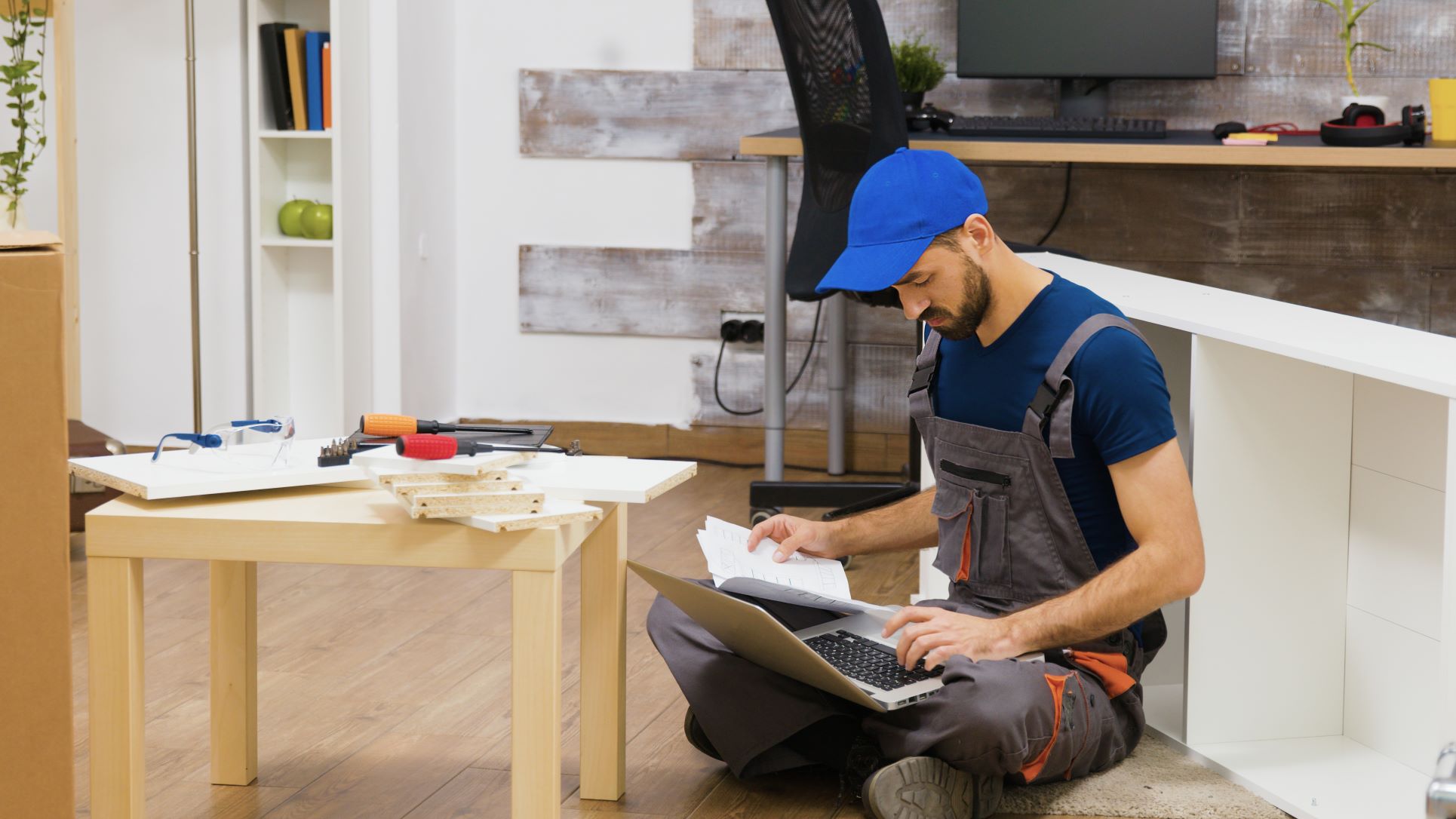 furniture-assembly-worker-uses-laptop-consult-instructions-handyman-doing-good-job.jpg